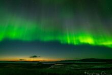 Northern light over a fjord Landscape and Aurora Borealis